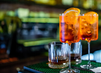 Aperol Spritz Cocktail in glass on bar counter