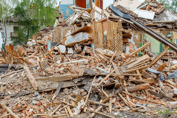 Rubble of old ruined house. Pile of construction fragments