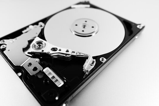 Computer hard drive with top cover removed. Disassembled HDD of a personal computer. Selective Focus