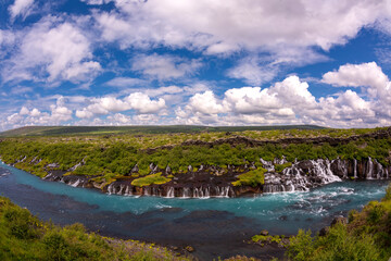 At 700 meters wide, the Hraunfossar waterfall apparently springs from a lava field, Iceland