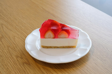 strawberry jelly cheesecake on white plate.Homemade bakery concept.