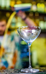 empty glass on a bar counter in bar or pub