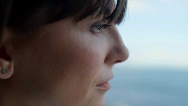Closeup leader woman looking panoramic window. Businesswoman enjoying ocean view
