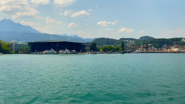 Travel on Lake Lucerne with Mountain View and City of Lucerne in a Sunny Summer Day in Lucerne, Switzerland.