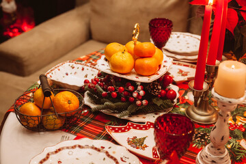 Christmas serving at home on the background of the Christmas tree.