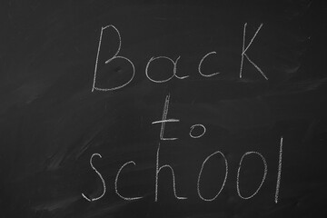education concept, back to school written on blackboard