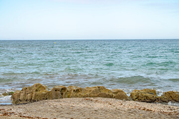 Sea waves lash line impact rock