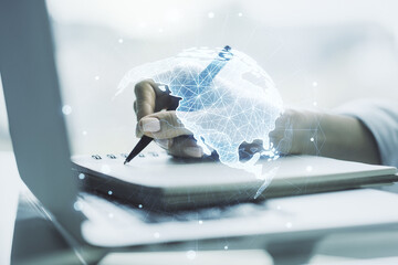 Double exposure of graphic America map and hand writing in notepad on background with laptop, big data and digital technology concept