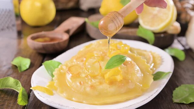 Seadas, traditional sardinian dessert with pecorino cheese, honey and lemon. Round meal with cheese, traditional in italy of the Sardinia region and south of italy. High quality 4k footage