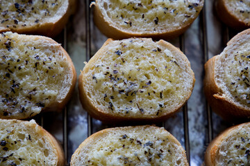 Fresh Slices of Garlic Bread with Black Pepper and Basil