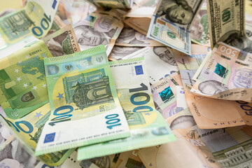 100 european money, 100 dollar and 1000 ukrainian hryvnia uah exchange concept, finance background.