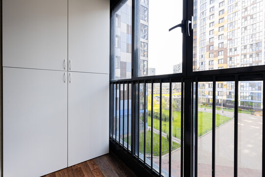 Empty balcony with closet and courtyard view