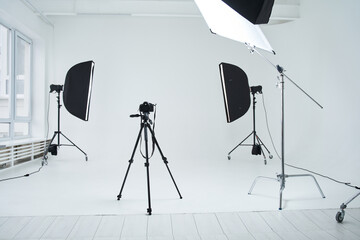 Special equipment for shooting standing at the spacious studio with a high ceiling