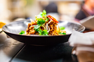 plate with food on table in cafe