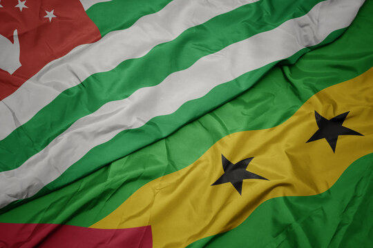 Waving Colorful Flag Of Sao Tome And Principe And National Flag Of Abkhazia.