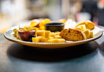 different types of cheese on a plate in cafe
