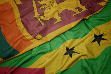 waving colorful flag of sao tome and principe and national flag of sri lanka.