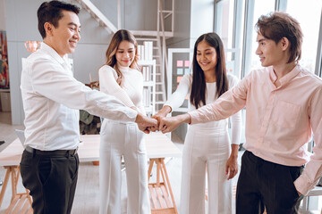 Stack of hands symbolizing trust and cooperation, Group of professional business people are working and brainstorming discussed about work in conference room.