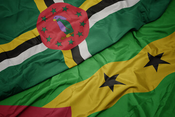waving colorful flag of sao tome and principe and national flag of dominica.