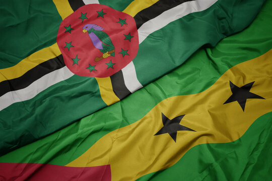 Waving Colorful Flag Of Sao Tome And Principe And National Flag Of Dominica.