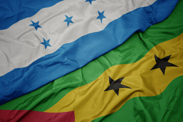 waving colorful flag of sao tome and principe and national flag of honduras.