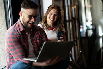 Young happy couple. Boyfriend and girlfriend drinking coffee together.