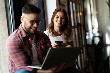 Young happy couple. Boyfriend and girlfriend drinking coffee together.