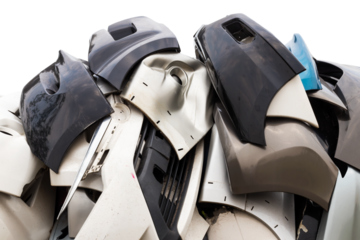 Close-up of a group of plastic fiber bumpers in front of a lot of different sizes of piles.