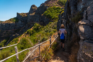 Naklejka premium Walking towards Pico do Arieiro from Ninho da Manta viewpoint, Madeira. Portugal