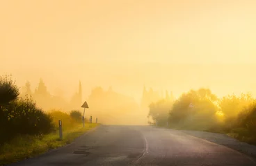 Foto auf Acrylglas Art rural landscape. Empty rural road summer misty morning in italy tuscany © Konstiantyn