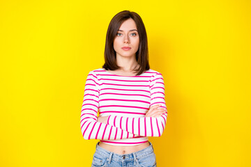 Closeup photo of young attractive serious woman hands folded look you help agent isolated on yellow color background