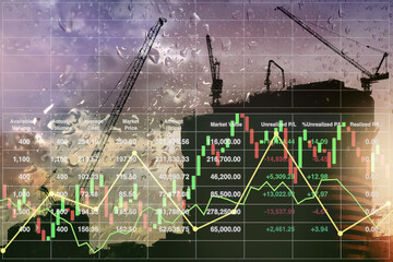 Stock financial investment index data business and industry background of successful investment on property development with silhouette onsite building construction  and  twilight rainy sky background