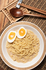 Udon and egg Japanese food with chopsticks and copy space