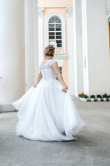Fototapeta premium bride spinning in her wedding dress
