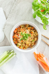mouthwatering Pearl barley with carrot, celery and zucchini on white background
