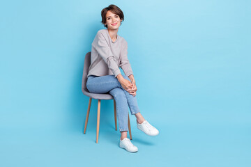Full length size photo of pretty positive cute lady wear nice clothes sit legs crossed empty space...