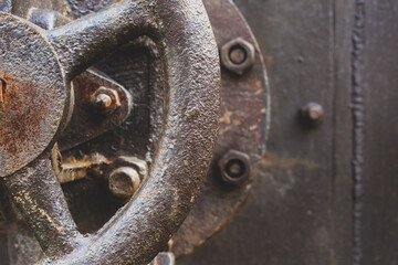 Industrial machine background. Steel, metal wall with valve and screws. Rust. Copy space