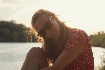 European-looking girl with blond hair and glasses