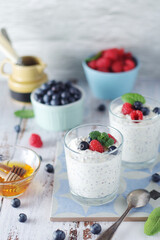 Greek yogurt in glasses with berries and quinoa	