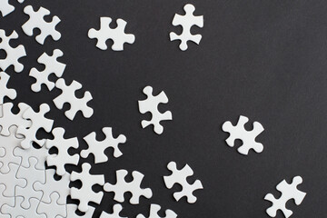 Close-up of blank white jigsaw puzzle texture background