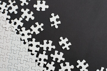 Close-up of blank white jigsaw puzzle texture background