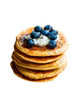 Pile of Oat Pancakes with Coconut cream ,Chia and Blueberries