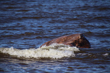waves on a rock
