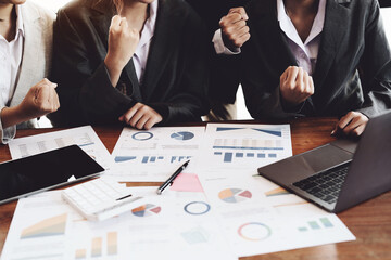 Businesspeople showing success with sales