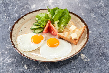 fried egg with toasts and salad