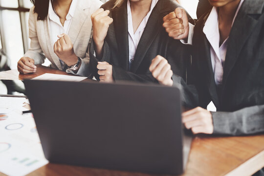 Businesspeople showing success with sales