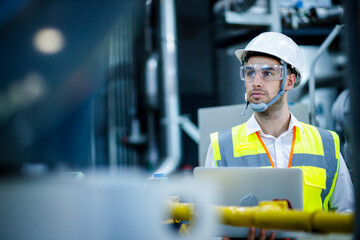Engineer industrial plant with a laptop in hand, Engineer looking of working at industrial...