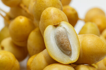 Pile of tasty sweet fresh dates on white background. ,close up