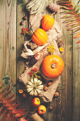 Autumn background - fallen leaves and healthy food on old wooden table.