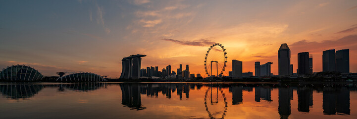 Silhouette of Singapore Marina Bay area and CBD district at dusk.
